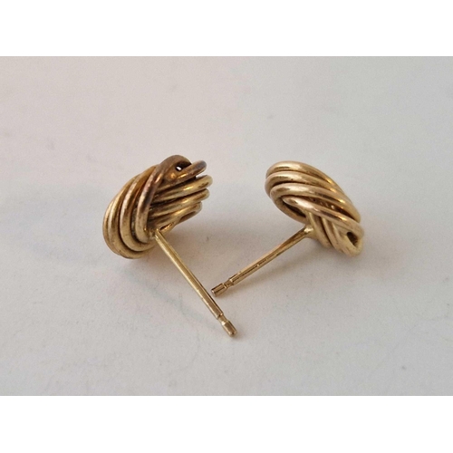 439 - A pair of knot ear studs 9ct 1.3 gms