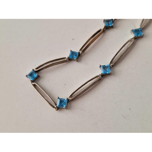 441 - A white gold and aquamarine/blue topaz Art Deco bracelet with eight interspersed star stones 9ct - 6... 