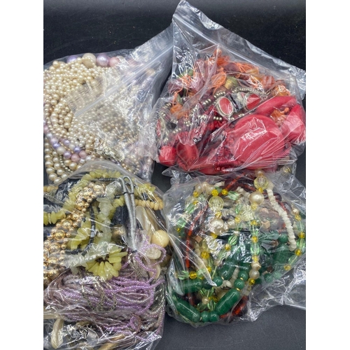 467 - Four large bags of assorted costume jewellery