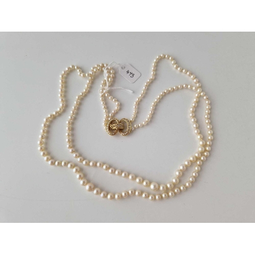 473 - A GOOD TWO STRAND PEARL NECKLACE WITH 18CT GOLD DIAMOND CLASP APPROX 8 GMS  20 INCH