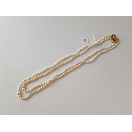 473 - A GOOD TWO STRAND PEARL NECKLACE WITH 18CT GOLD DIAMOND CLASP APPROX 8 GMS  20 INCH