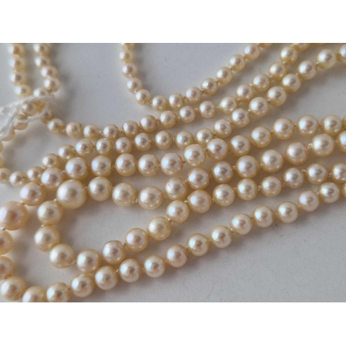 473 - A GOOD TWO STRAND PEARL NECKLACE WITH 18CT GOLD DIAMOND CLASP APPROX 8 GMS  20 INCH