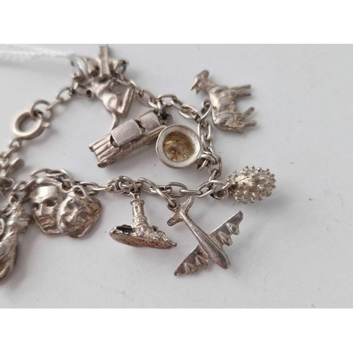 487 - A silver charm bracelet 24 gms