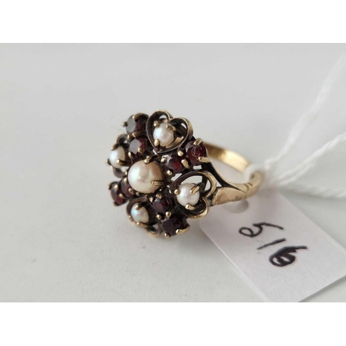 516 - A fancy garnet and pearl ring 9ct size N 4.3 gms