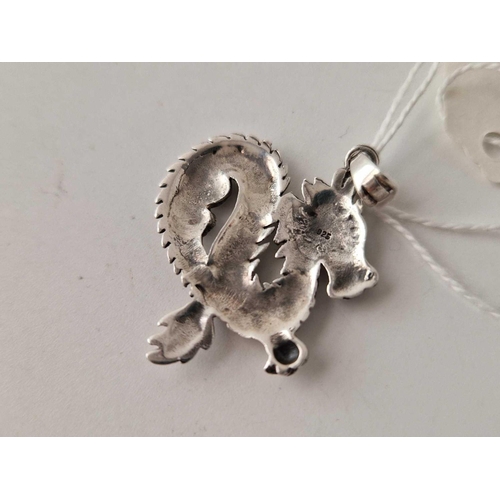 534 - A silver dragon pendant