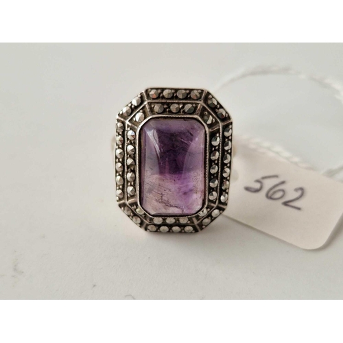 562 - A art deco silver and amethyst cabochon ring size R