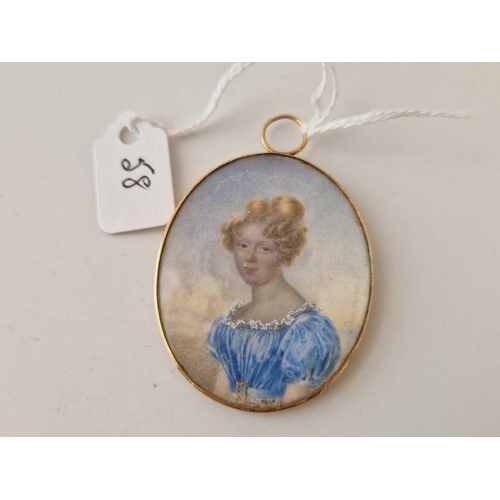 58 - A Georgian gold framed hand painted miniature of a young lady with hair memorial back boxed