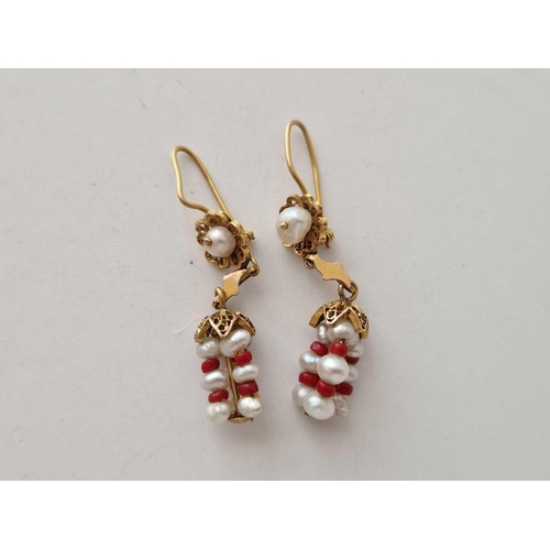 580 - A pair of antique high carat gold drop earrings set with pearls and coral