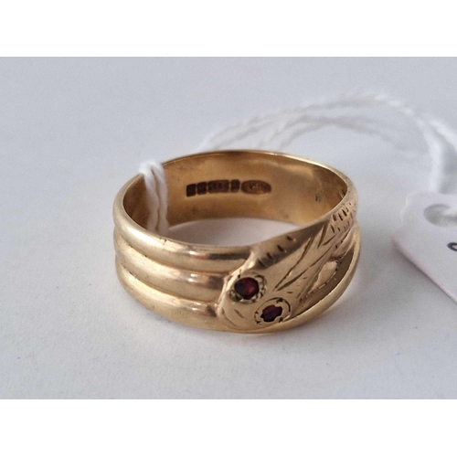 586 - A wide snake ring with garnet eyes 9ct size V 5.5 gms