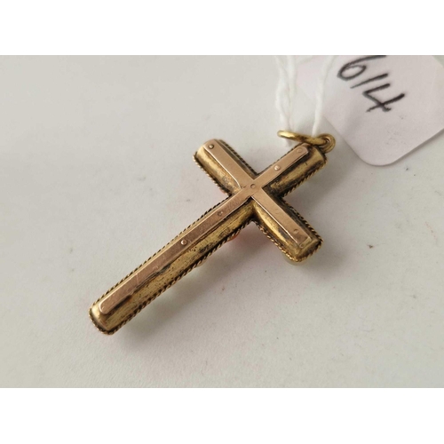 614 - A antique gold cased coral and mop crucifix 2.2 gms