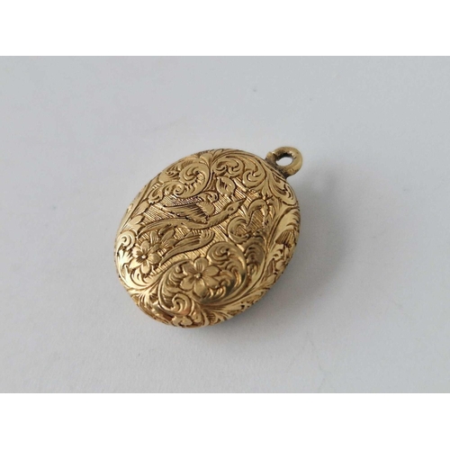 617 - A antique engraved gold back locket