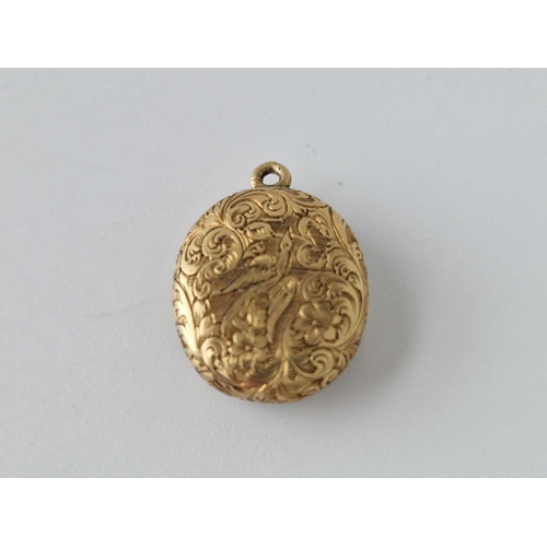 617 - A antique engraved gold back locket