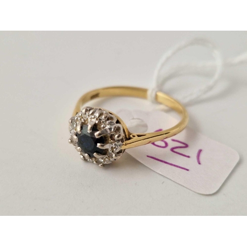 621 - A sapphire and diamond cluster ring 18ct gold size V 4.2 gms