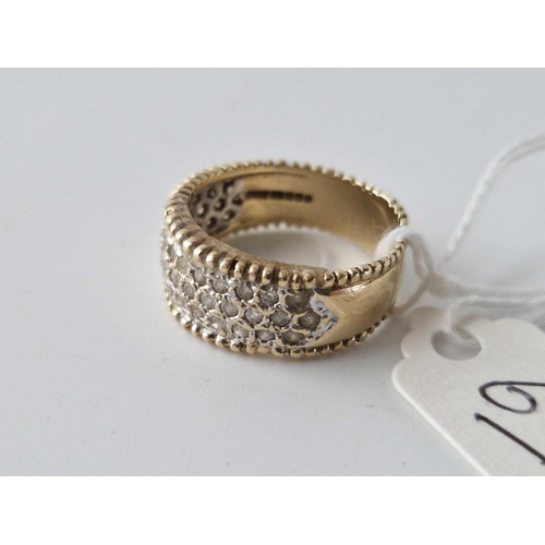 63 - A heavy wide diamond set band ring in 9ct gold size Q 5.2g