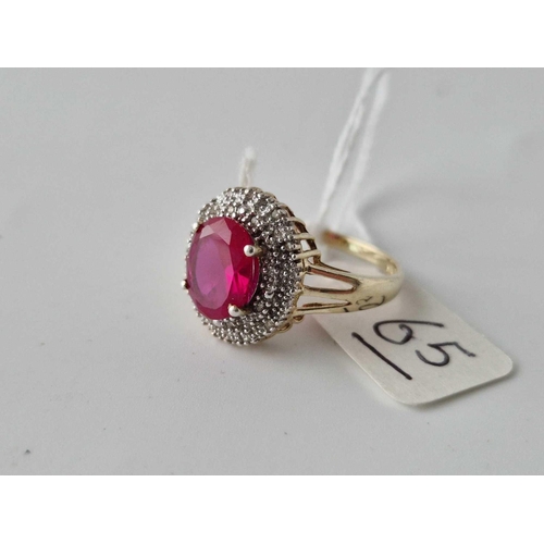 65 - A silver red stone ring the central stone surrounded with diamonds size Q 3.3g