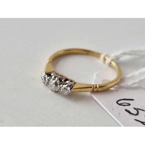 652 - A three stone diamond ring 18ct gold size M 1.8 gms