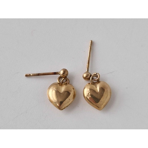 653 - A pair of heart dangle earrings 9ct