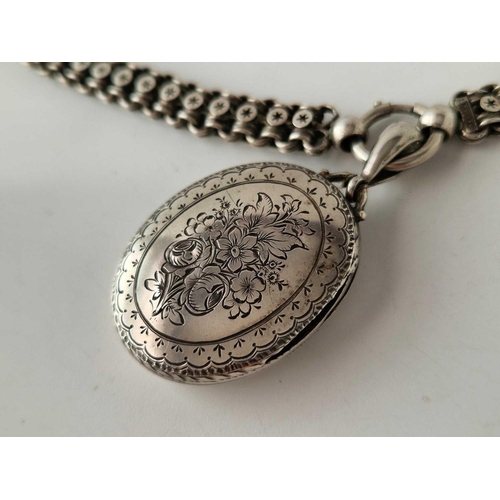 661 - A Victorian engraved silver locket and chain Birmingham 1895 40 gms