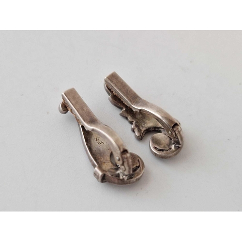 663 - A pair of silver marcasite ear clips