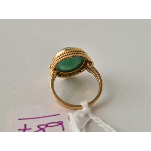 687 - A high carat gold and jadeite ring size H 4.7 gms