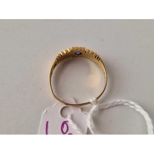 692 - A sapphire and pearl three stone ring 18ct gold size P 2.4 gms