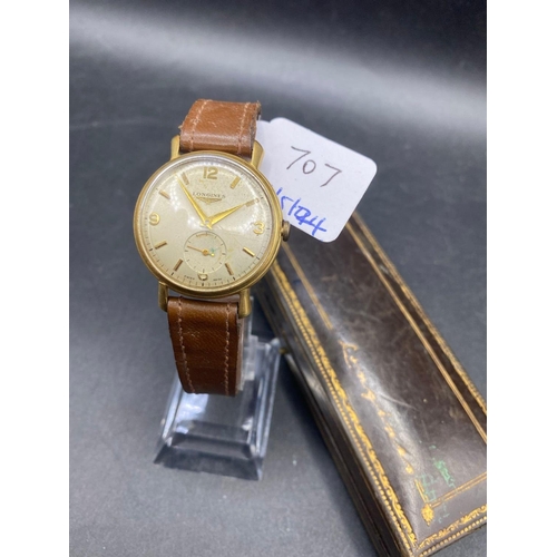 707 - A LONGINES GENTS WRIST WATCH WITH SECONDS DIAL 18CT GOLD ON LEATHER STRAP 35GMS INC. IN LONGINES BOX