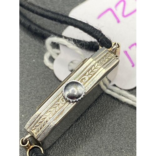 726 - A platinum cased ladies diamond cocktail watch with leather strap and 9ct fixings