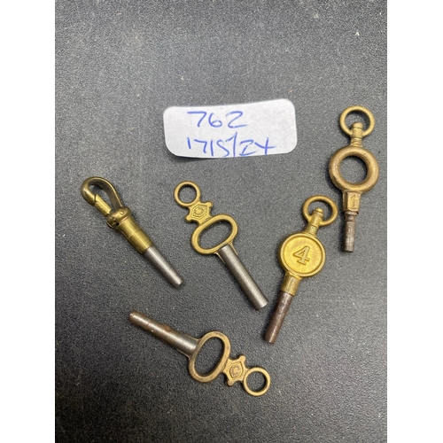 762 - A bag of five antique watch keys