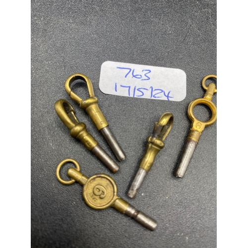 763 - A bag of five antique watch keys