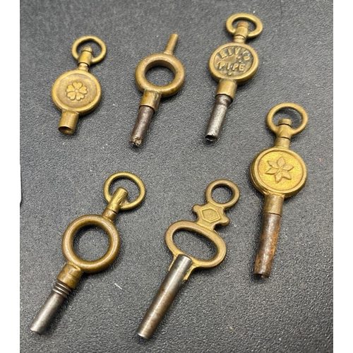 764 - A bag of five antique watch keys