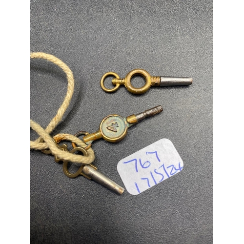 767 - A bag of three antique watch keys