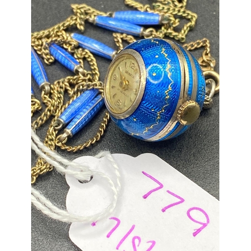 779 - A silver and enamel ball watch by ORNATA with neck chain