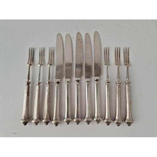 853 - Eleven silver handled fruit knives and forks, Sheffield 1914