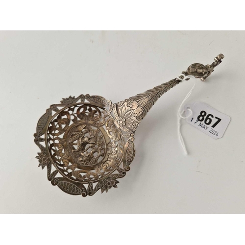 867 - A Continental sifter spoon with pierced and embossed decoration