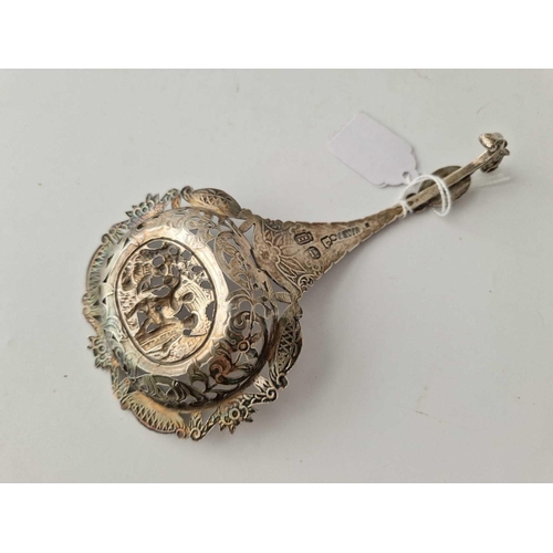 867 - A Continental sifter spoon with pierced and embossed decoration