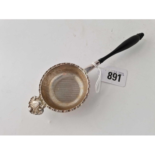 891 - A tea strainer with turned wood handle, Sheffield 1968 by FH