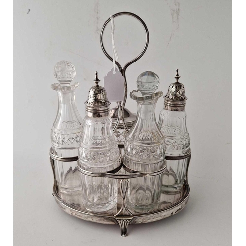 901 - A good oval George III cruet set with five bottles and central ring handle, 9.5 inches high, London ... 