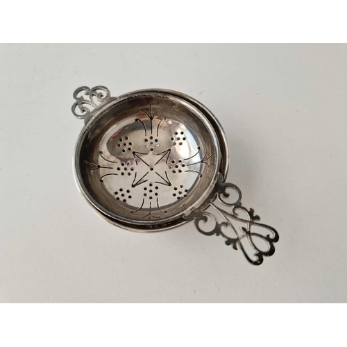 922 - Two handled tea strainer on stand, 4.5 inches over handles, Birmingham 1966, 76 g