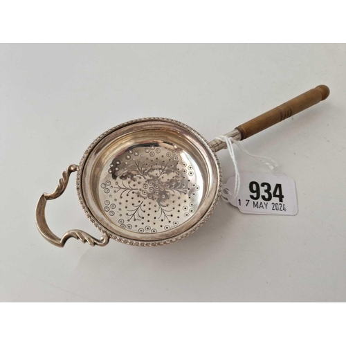 934 - A tea strainer with turned wood handle, Birmingham 1931