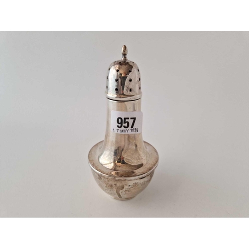 957 - A bottle shaped sugar caster with pull off cover, 6 inches high