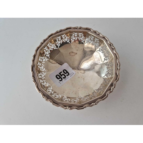 959 - A pierced circular dish on three pad feet, 4 inches diameter, Birmingham 1938,47 g