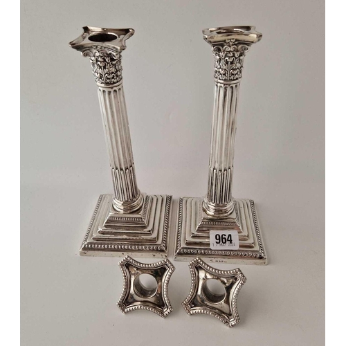 964 - A pair of candlesticks with step square bases, fluted stems and detatchable nozzles, 9.5