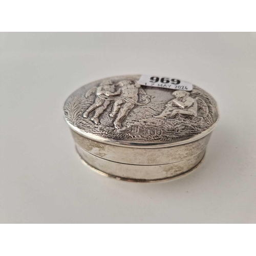 969 - An oval jar and cover, the top embossed with cherubs, 3.5