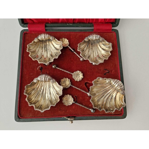 971 - A set of four shell shaped salts with matching spoons, Chester 1899