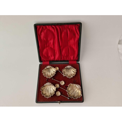 971 - A set of four shell shaped salts with matching spoons, Chester 1899