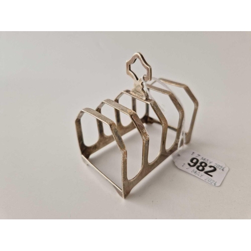 982 - A five bar toast rack on bracket feet, 3