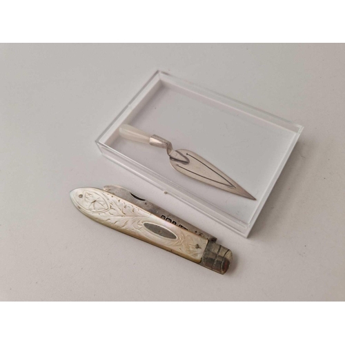 985 - An attractive fruit knife with M.O.P body, Sheffield 1911 and a trowel shaped bookmark with import m... 