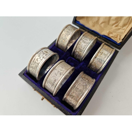 995G - Boxed set of six scroll engraved napkin rings. Chester 1909. 55gms