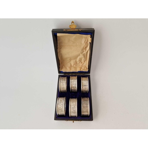 995G - Boxed set of six scroll engraved napkin rings. Chester 1909. 55gms