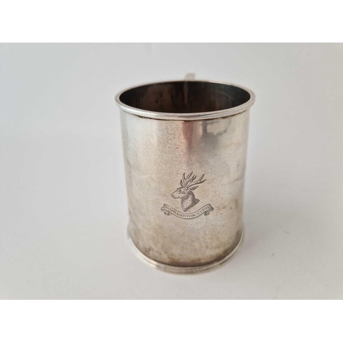 995L - Christening mug of Georgian design with crest. 3.5 in high. London 1935 By J C V. 175gms